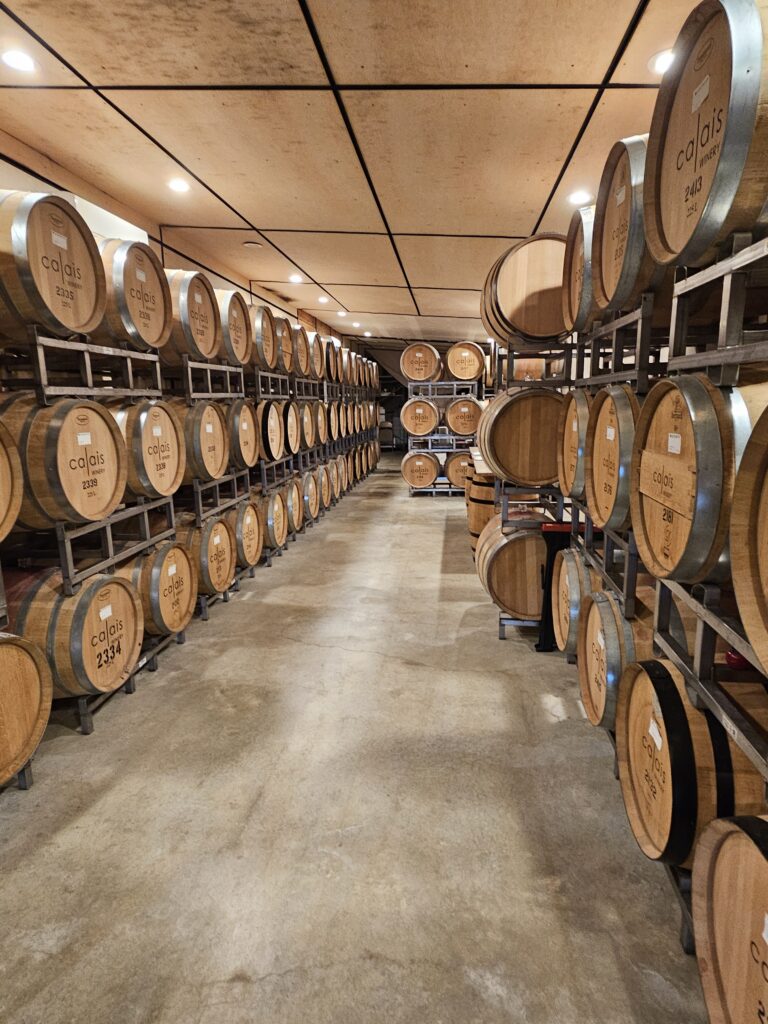 Inside Calais with wine barrels on racks